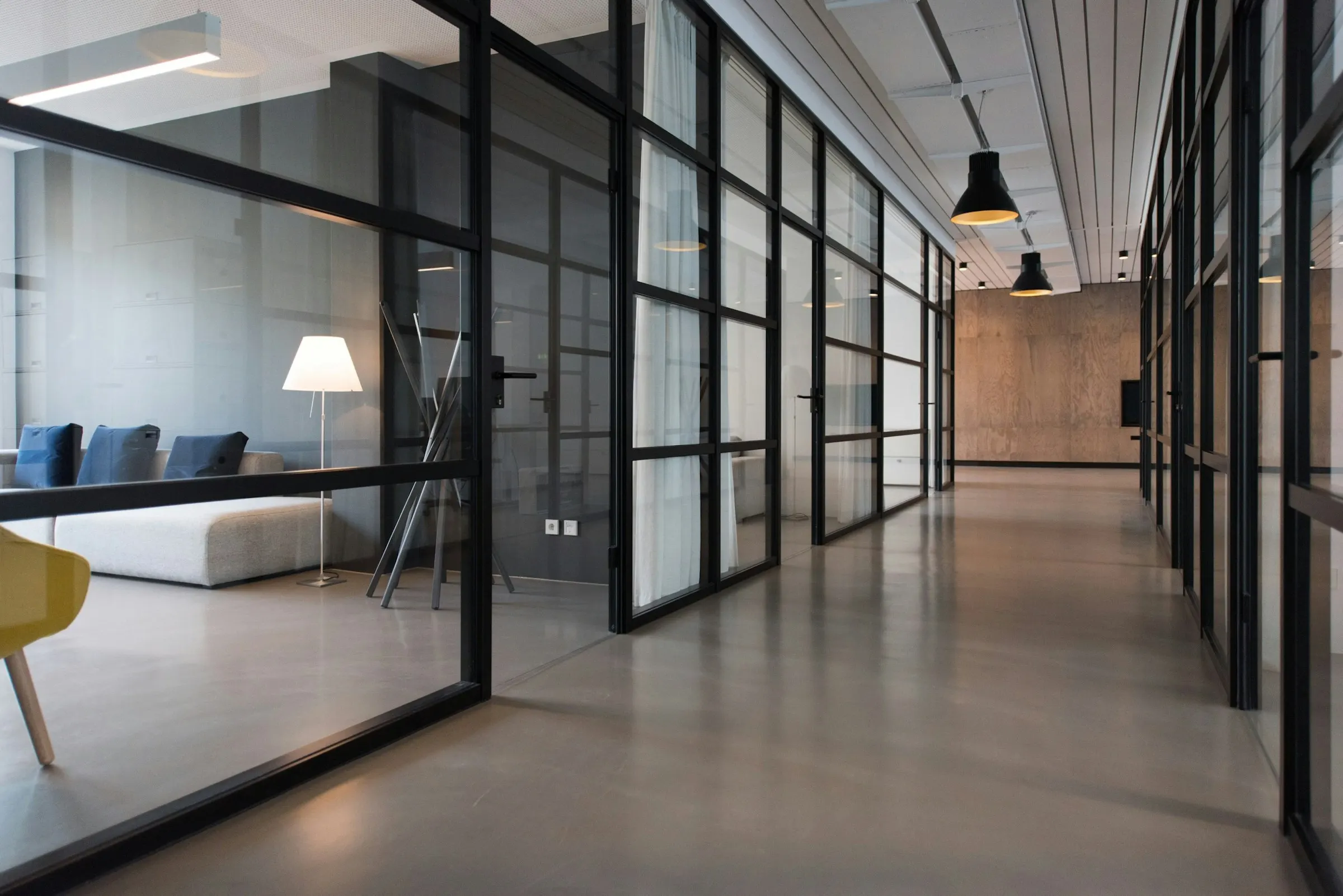 A corridor between glass cabins