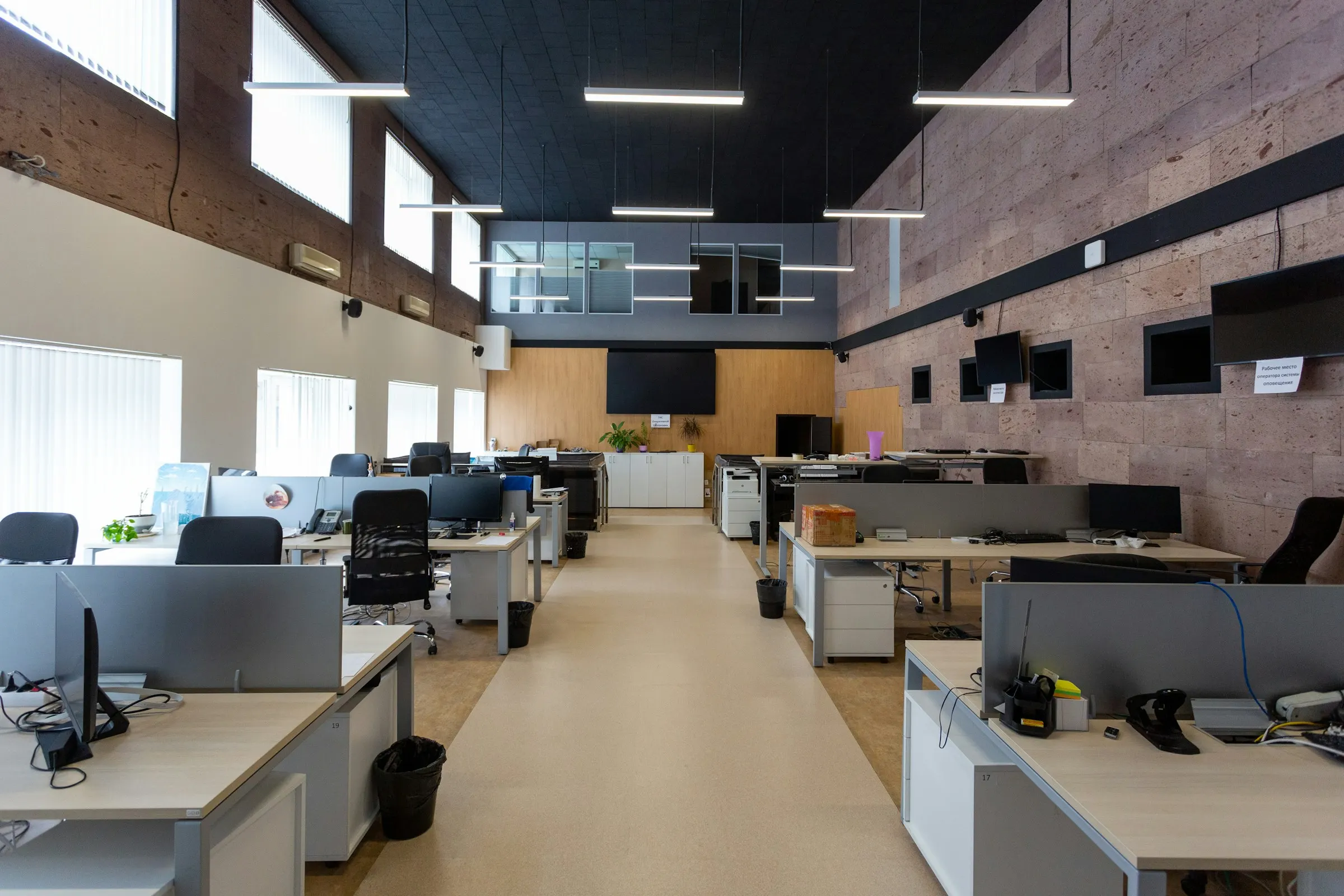 An open-plan office floor with rows of desks